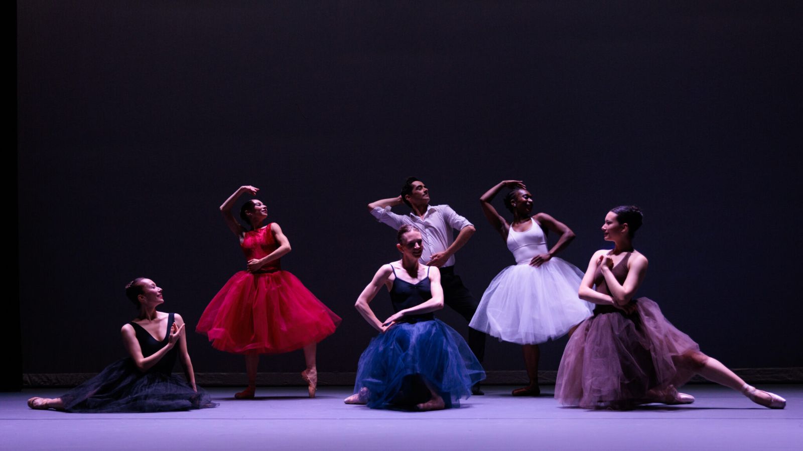Five dancers in various poses
